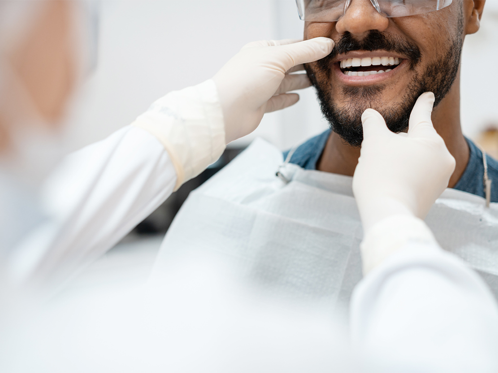 dentist looking at patients teeth